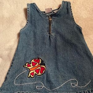 Butterscotch, size 4, denim with front zipper and yellow and red butterfly.